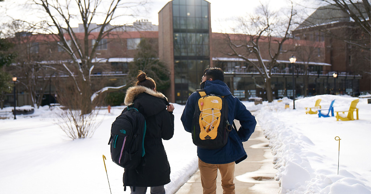 Image of students walking on a snowy quad at La Salle University