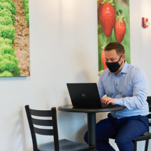 Image of a man sitting in the EatWell Café