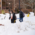 Image of students at La Salle University walking through the snow.