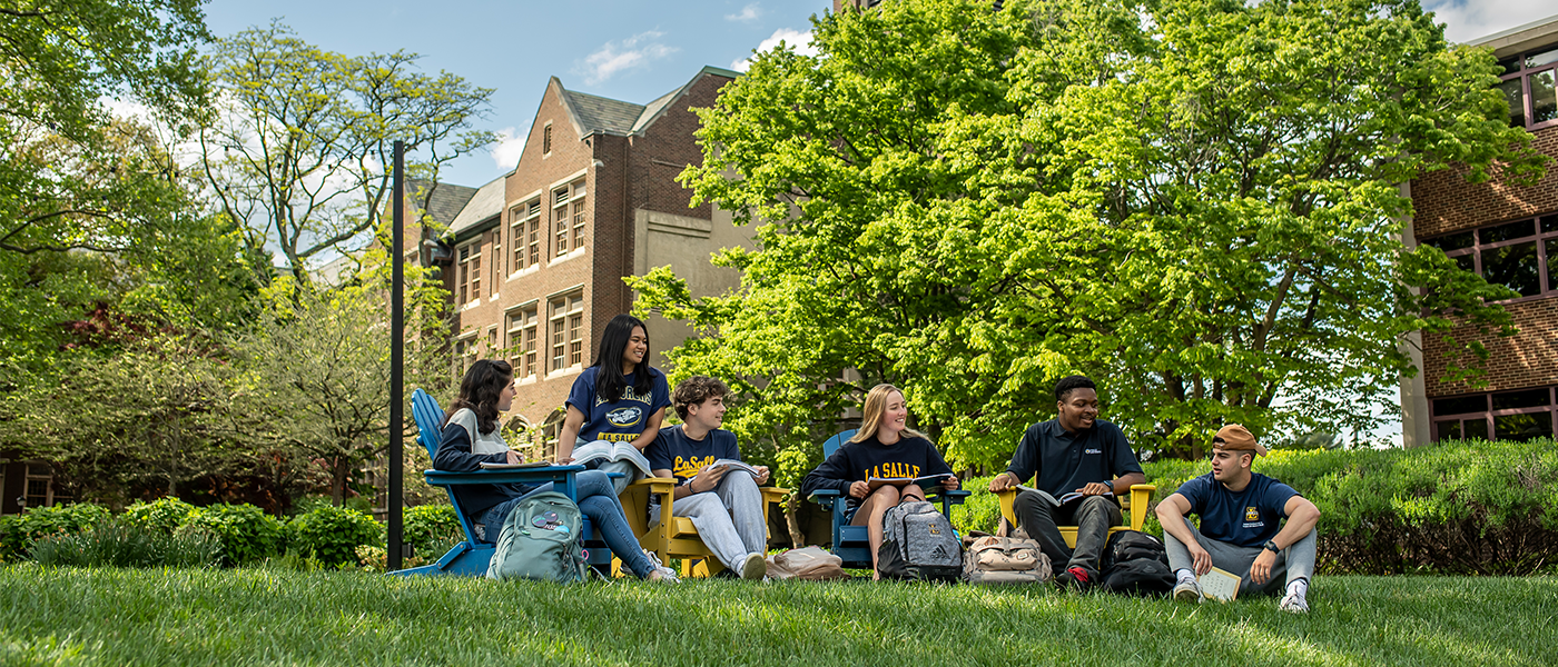 Image of students sitting on the Hansen Quad.