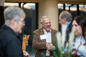 Image of two men shaking hands.