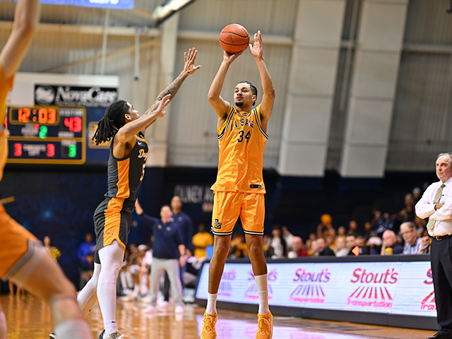 Image of a men's basketball player about to shoot a basketball