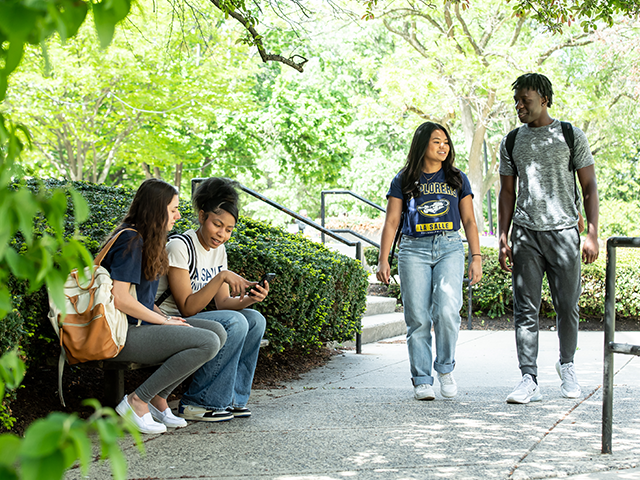 Image of students walking around campus.