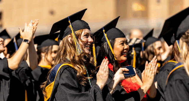 Image of students clapping at Commencement