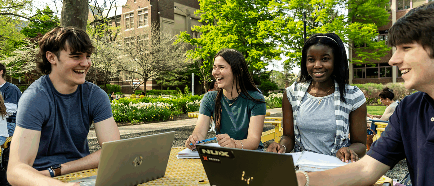 Image of students sitting at a table on the Hansen Quad
