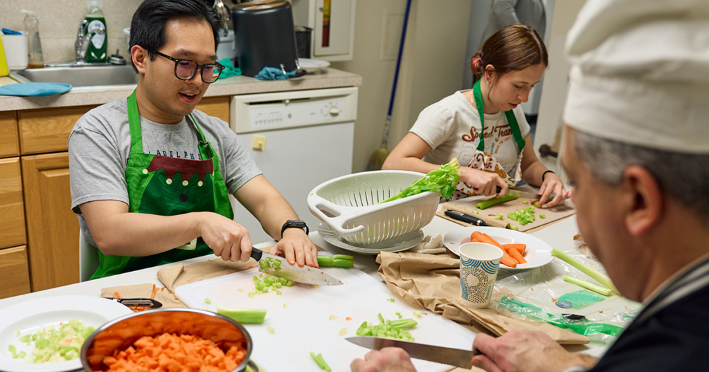 Students and faculty at La Salle University prepare a meal to celebrate The Solemnity of the Immaculate Conception of the Virgin Mary.