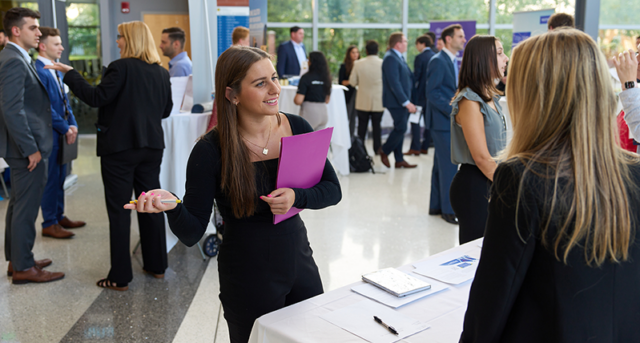 Image of a student talking to a potential employer