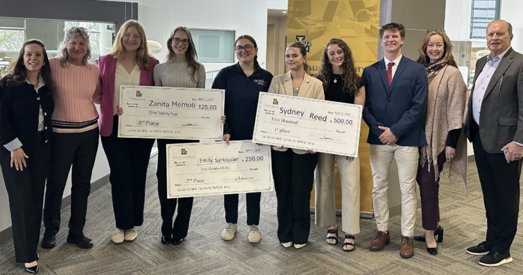 Emily Sarkissian, '26, (fourth from left) being awarded second place in the La Salle School of Business sales competition.