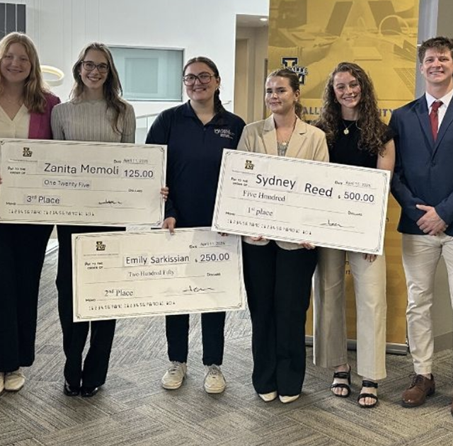 Emily Sarkissian, '26, (fourth from left) being awarded second place in the La Salle School of Business sales competition.