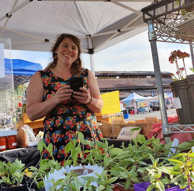 Liz Wagner, '11, with produce from Crooked Row Farm.