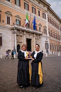 Nappi and her mother, Nonna Franca, with their book outside Parliament in Rome, Italy.