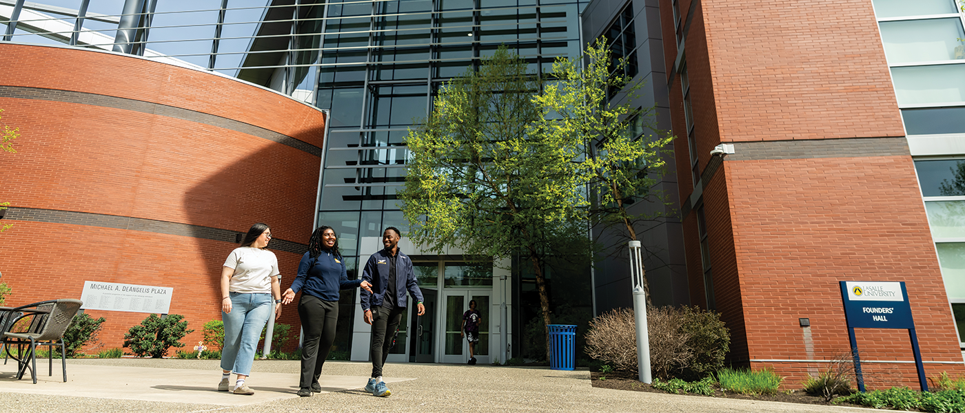 Image of students walking outside of Founders Hall