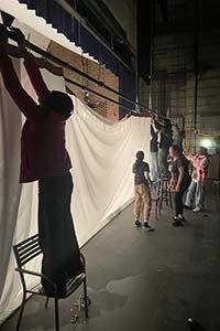 Alexandra Sulock, '27, working backstage with The Masque.