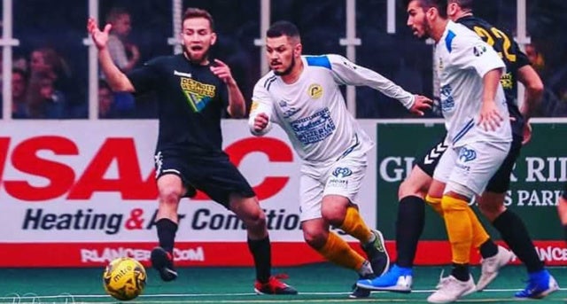 Jeremy Ortiz, '08, (center) playing for the Rochester Lancers.