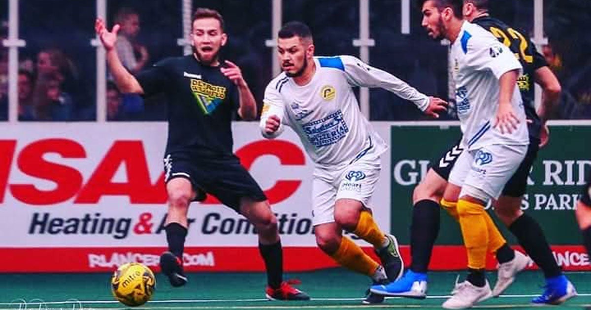 Jeremy Ortiz, '08, (center) playing for the Rochester Lancers.
