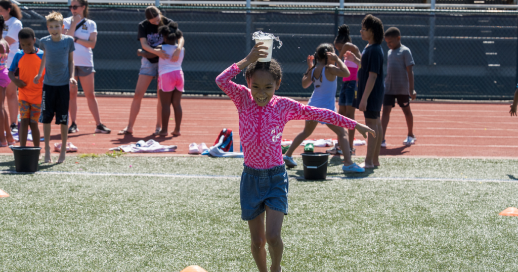 Student participating in field day game