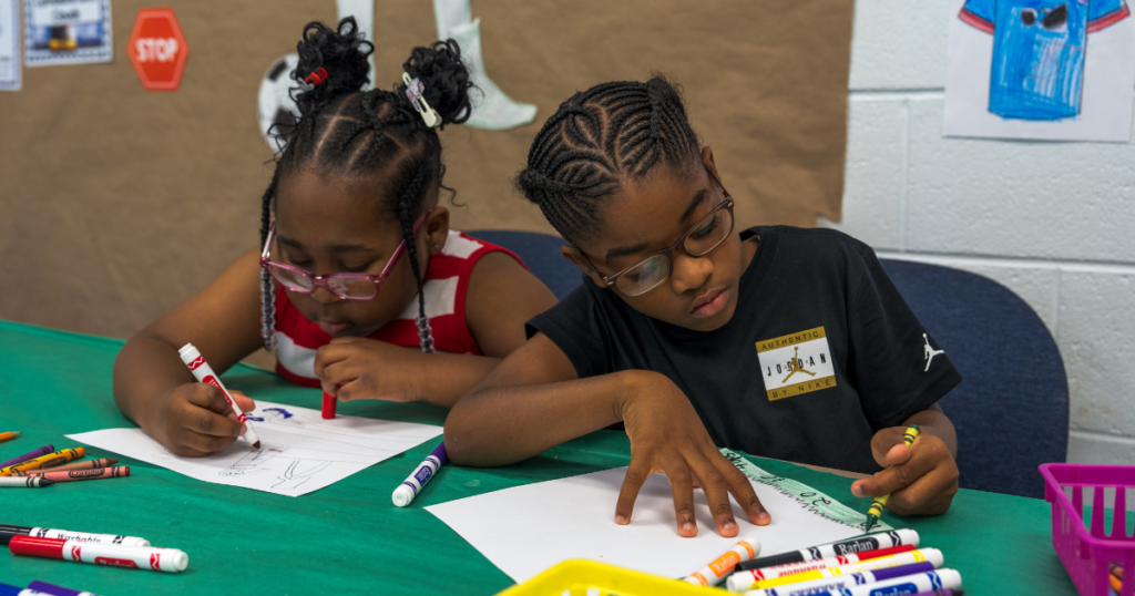 Students writing on paper
