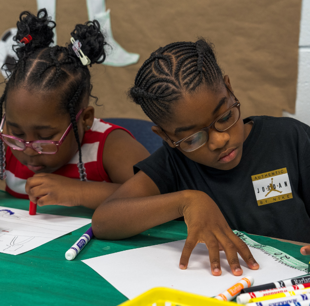 Students writing on paper