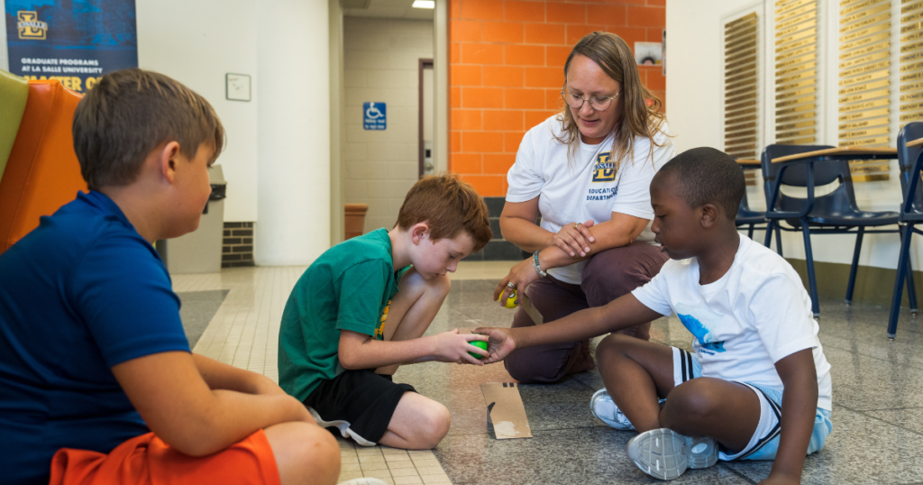 Students working with teacher