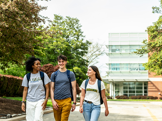 Image of 3 students walking toward the Union