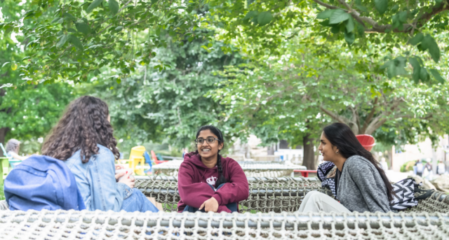 Students in a hammock talking