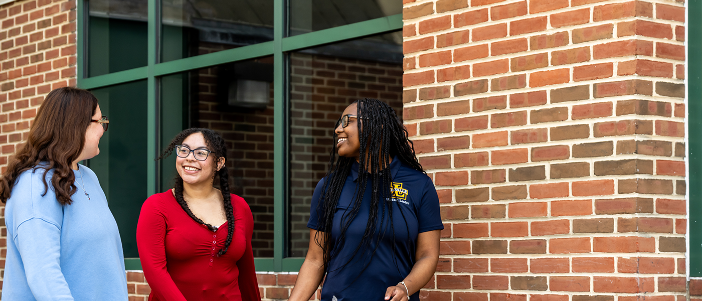 Image of 3 students walking outside