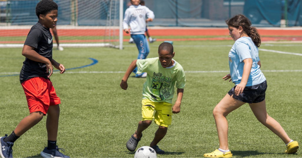 Students playing soccer