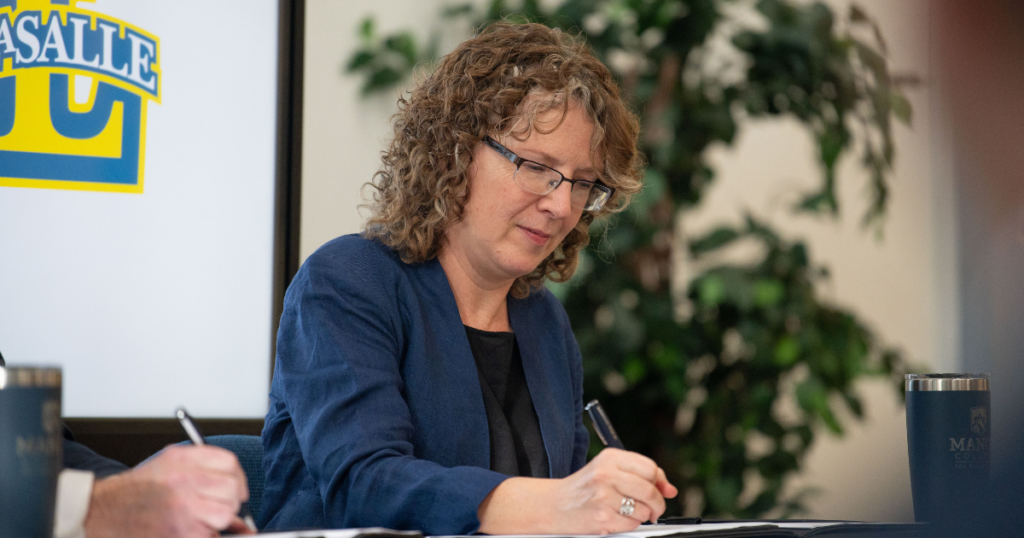 Woman signing documents