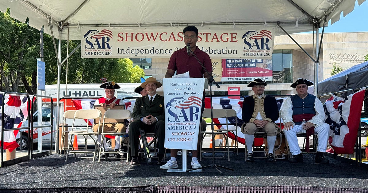 Dezlen Long, '27, speaking at the Philadelphia Continental Chapter of the Sones of the American Revolution stage at Independence Mall during the America250 July Fourth celebrations.