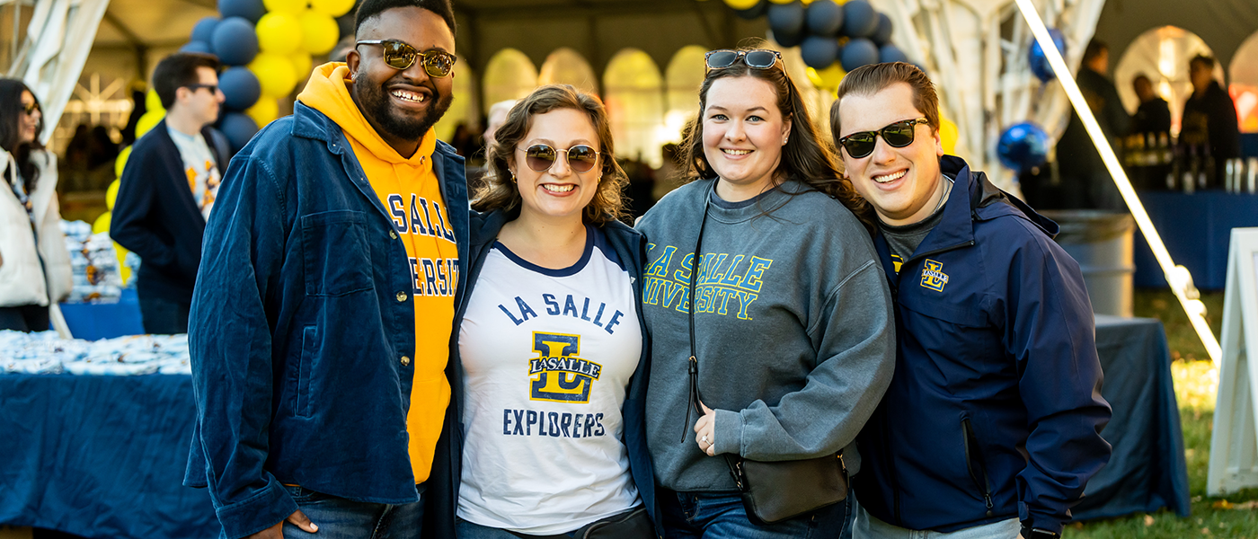 Four alumni at Homecoming