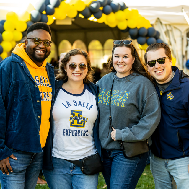 Four alumni at Homecoming