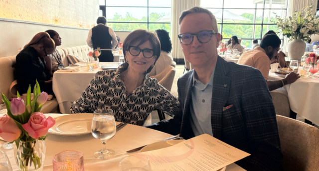 Two people sitting at table