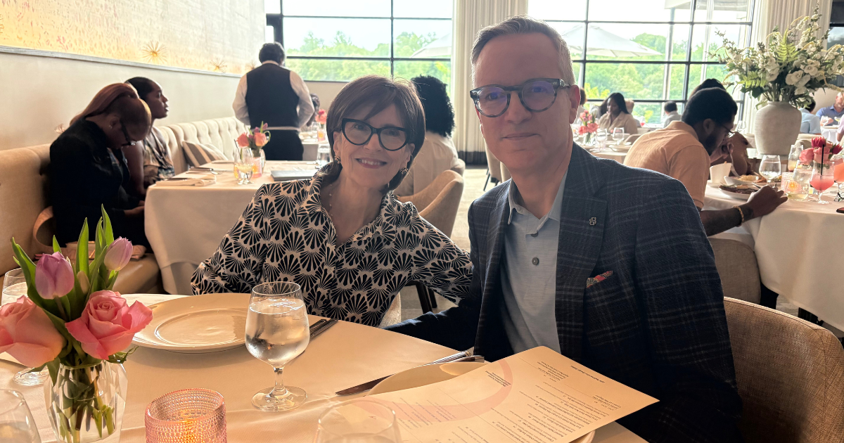 Two people sitting at table